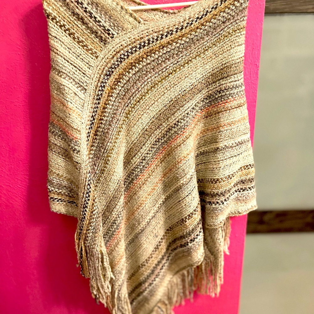 Poncho, cute cover up.  Great mix of neutral colors…pink, cream, orange, green.